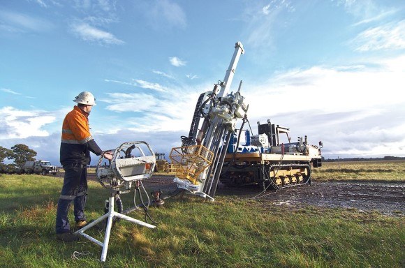 Man on site using drilling machine