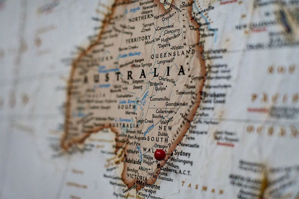 Close up map of Australia with a red pin in city of Sydney