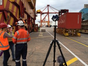 People chatting in a shipping yard