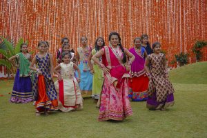 Bollywood dancer teaching young girls how to dance 